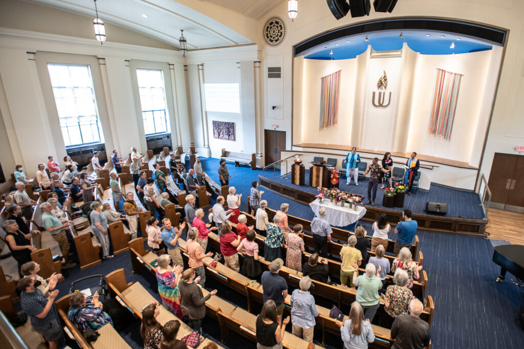 a group of people worship in a Unitarian Universalist congregation