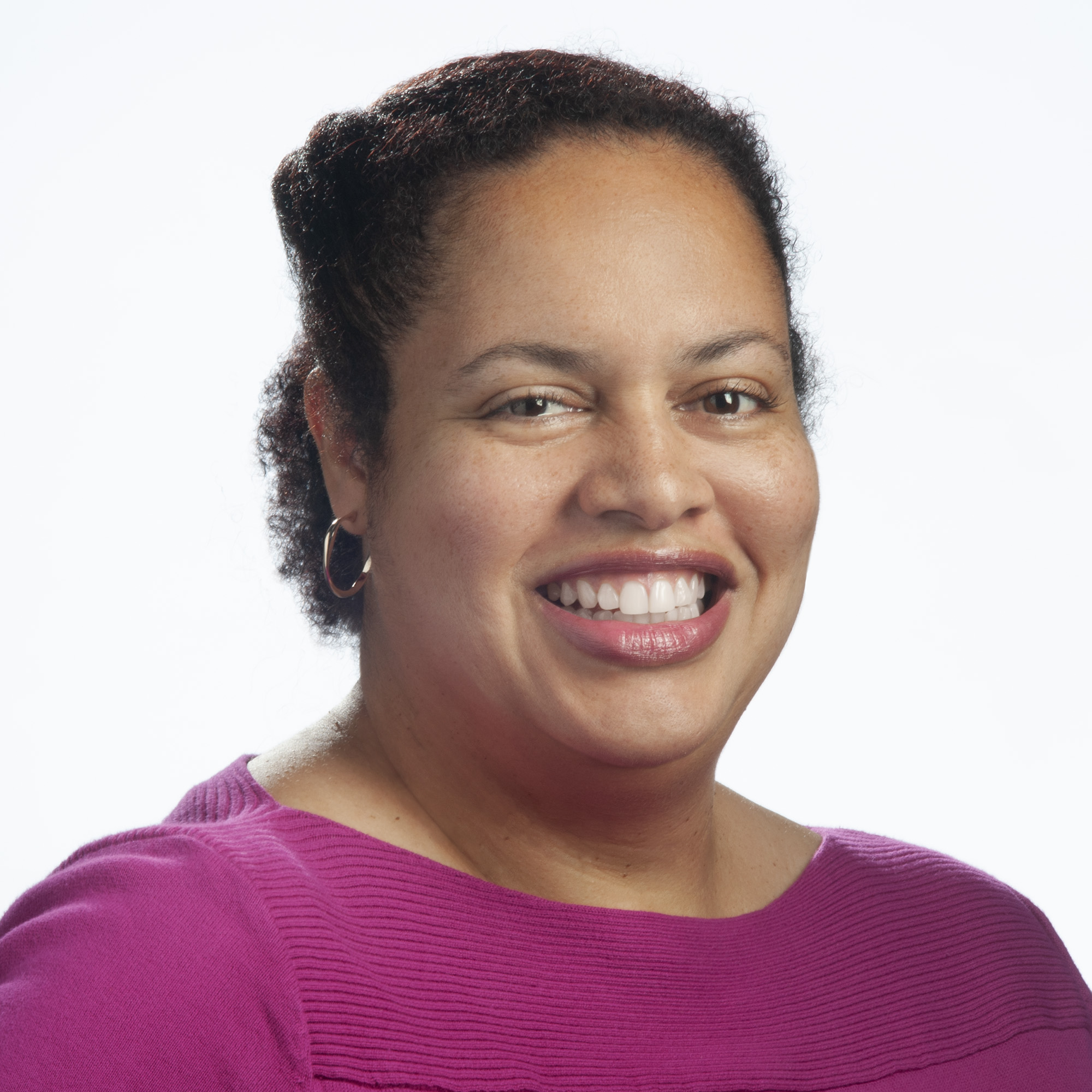 Black woman smiling at the camera